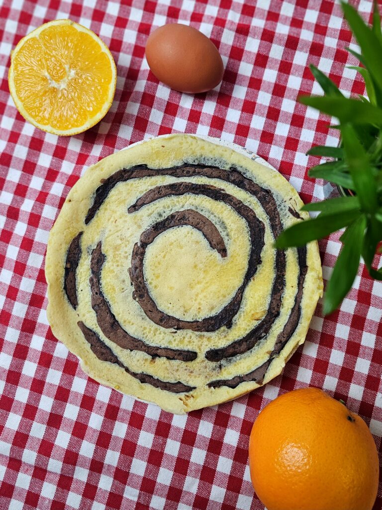 "Découvrez une recette originale de crêpes tourbillons orange et cacao, parfaite pour la DME dès 12 mois, saine, gourmande et facile à préparer !"